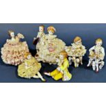 A collection of Irish Dresden figures to include a lady in a frilly pink dress 'Angelina', a small