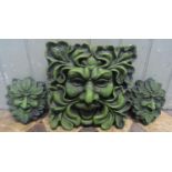 Three small cast composition stone ornamental green man wall plaques, the largest example 28cm