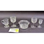 A collection of matching Victorian glassware with a rolling wave pattern, including wine glasses,