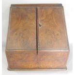 A 19th century burr walnut stationary box with a fitted interior over a hidden drawer, (as found).