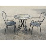 A weathered heavy gauge steel three piece garden terrace/bistro set, the table with circular