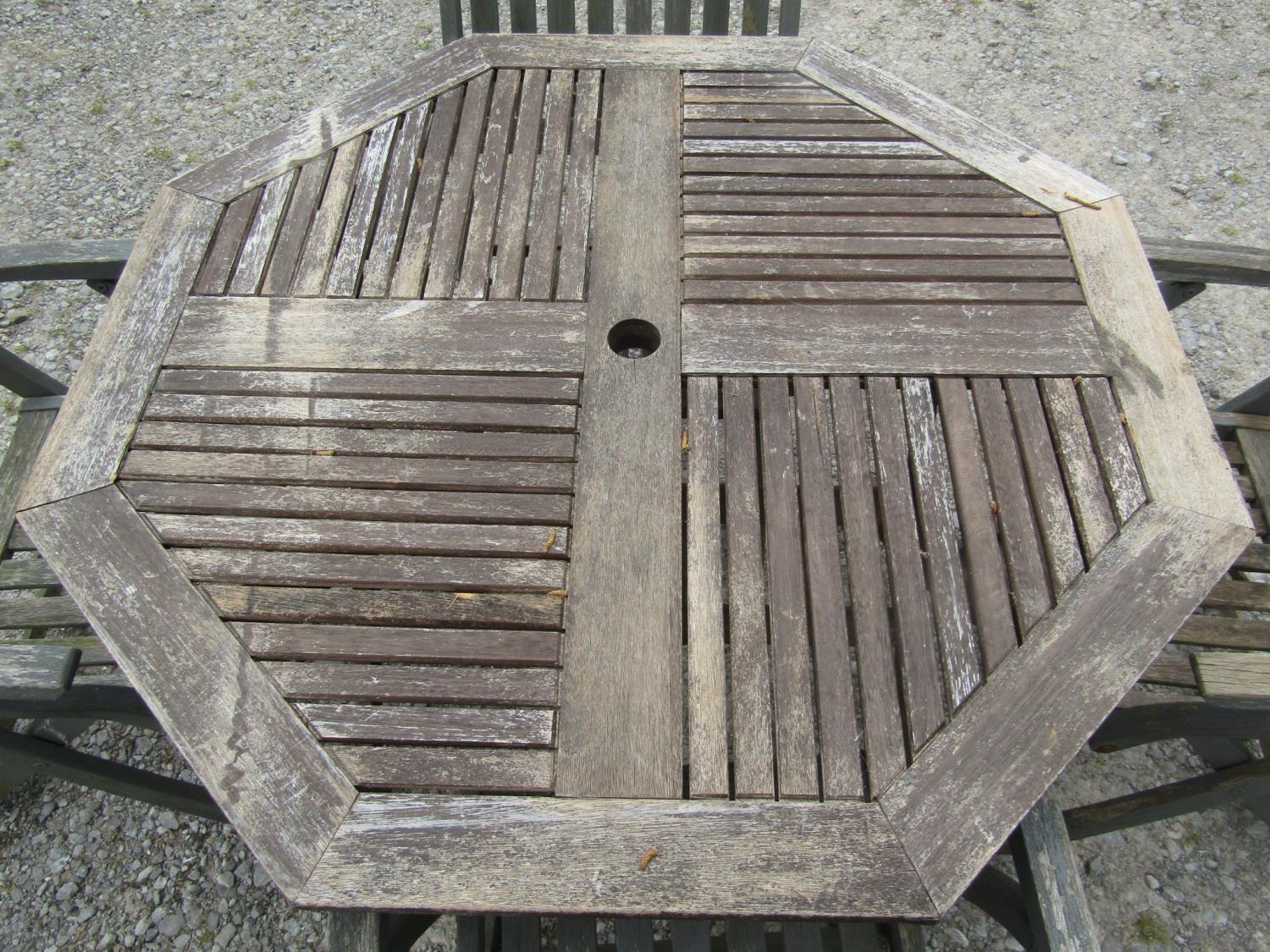 A weathered folding hardwood garden table with octagonal slatted panelled top, together with a set - Image 2 of 2