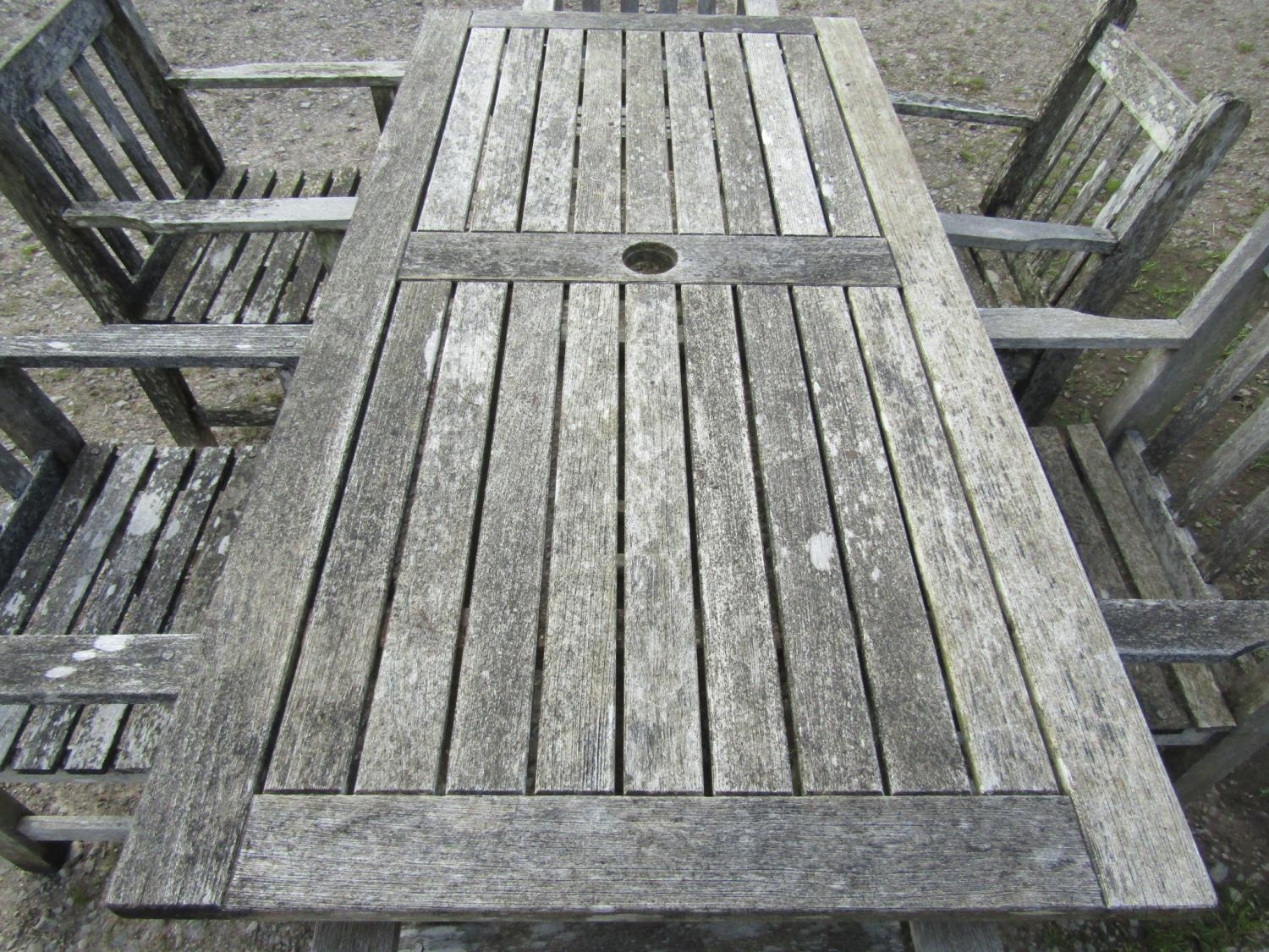 A weathered Gloster teak garden table with rectangular slatted panelled top, raised on rectangular - Image 2 of 5