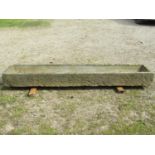 A good weathered rectangular carved natural stone trough with tapered interior, 242cm long x 47cm
