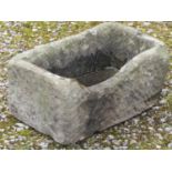 A small rectangular carved natural stone trough 50 cm long x 31 cm wide x 23 cm high