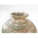 A large Middle Eastern copper vessel with intricate floral patterns and piercings 53cm high