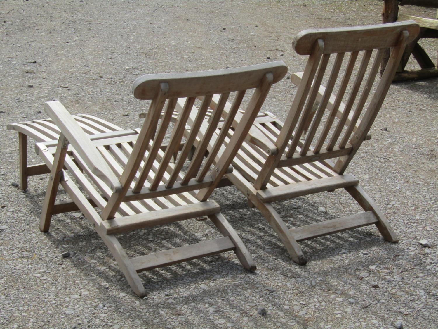 A pair of weathered contemporary teak folding steamer type garden lounge chairs with slatted - Image 3 of 3