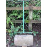 A 19th century stone garden roller with painted T shaped wrought iron handle, 56 cm wide