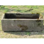 A weathered rectangular natural stone trough, 93cm long x 38cm wide x 30cm high