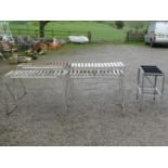 Four aluminium greenhouse potting tables of varying size and design, two with wooden open slatted
