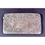 A silver card case with all over scrolled decoration, Birmingham 1900, maker Walker & Hall, together