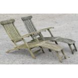 A pair of weathered teak folding garden steamer type lounge chairs with slatted seat, back and
