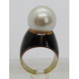 Yellow metal pearl dress ring with black enamel ground, size K/L, 11.5g