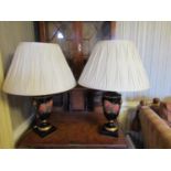 A pair of Georgian style vase shaped lamps in black colourway with rosebud detail