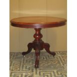 Small Victorian mahogany loo table with circular top, raised on a turned pillar and scrolled tripod,