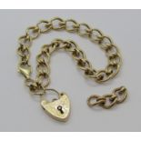 Vintage 9ct fancy link bracelet with heart padlock charm, plus spare links, 19.2g (padlock