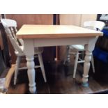 A contemporary pine kitchen table on painted supports 90 cm square together with a set of four
