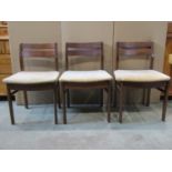 Two sets of 3 mid century teak ladder back dining chairs by Elliot's of Newbury of varying design