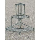 A green painted and weathered light steel floorstanding conservatory/garden corner plant stand on