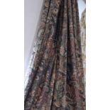 One pair of extra long curtains with paisley patterned fabric in muted colours, lined with pencil