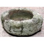 A small antique weathered carved stone mortar 30 cm diameter approximately x 14 cm high (af)