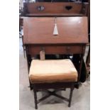 An arts and crafts open writing bureau with fall flap and cut heart motifs