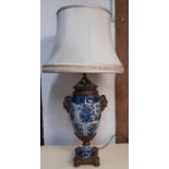 A good quality reproduction blue and white crackle glazed oviform table lamp with mask acanthus
