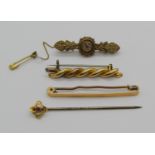 Group of antique gold jewellery comprising two 15ct brooches, a further unmarked rope twist brooch