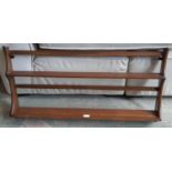 An Ercol two tier wall mounted plate rack