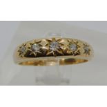 18ct five stone diamond gypsy ring with star-cut detail, size N/O, 3.5g