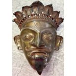 A Bronze Jamadi Bhuta Mask with a crown of cobras, from India, 26cm x 20cm approx.