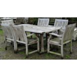 A heavy gauge weathered contemporary teak rectangular garden table with shaped ends and slatted