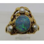 Arts & Crafts opal and pearl ring in yellow metal, monogram to interior 'WFR', size O/P, 6.2g