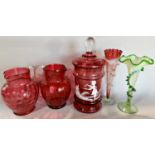 Two cranberry coloured ewers with celery handles, Mary Gregory jar and cover and two trumpet