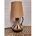 A mid 20th century ceramic table lamp and shade