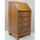 A small Georgian style writing bureau with yew wood veneers (supports) 55 cm wide