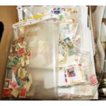 Two boxes of unsorted worldwide stamps