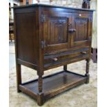 Reproduction old English style low oak side cupboard enclosed by a pair of linen fold panelled