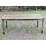 A Swan Hattersley weathered teak rectangular garden table with slatted top raised on square cut