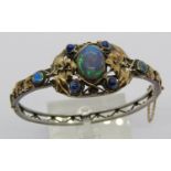 Arts & Crafts opal and sapphire hinged bangle in the manner of Rhoda Wager, in unmarked white and