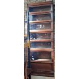 A seven sectional oak Globe Wernicke sectional bookcase with glazed up and over doors, five