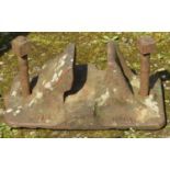 A cast iron GWR railway line shoe complete with bolt fittings