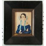 Primitive miniature portrait of a lady in blue dress holding a book, watercolour and pencil in card,