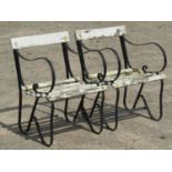 A pair of vintage sprung steel garden chairs with painted wooden lathes, 54 cm wide