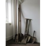A small collection of vintage long wooden handled gardening related hand tools to include a