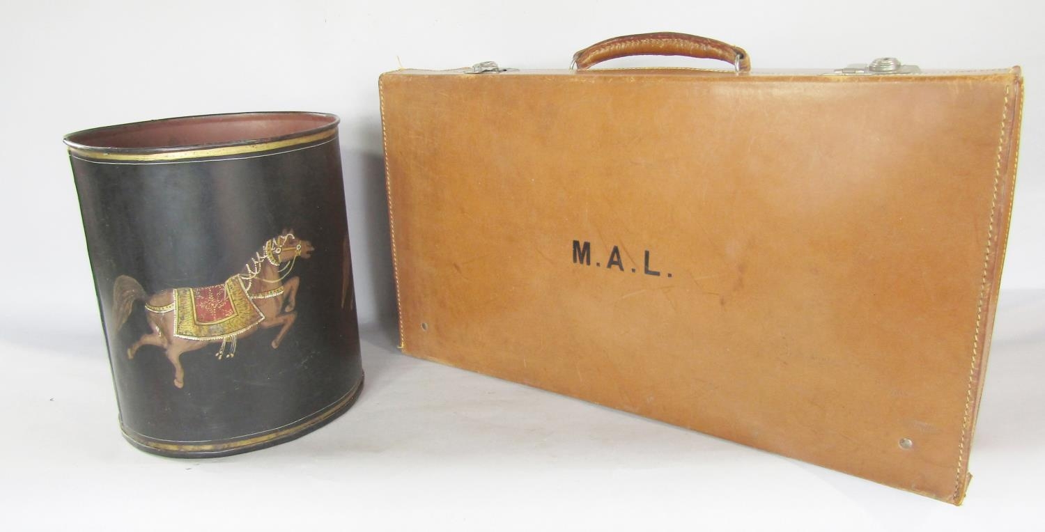 A vintage Derry & Tomb leather suitcase, initialled M.A.L, and a tin waste paper bin, decorated with