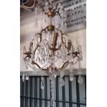 A six branch chandelier with pear cut floral and other glass droplets, 80cm high approx