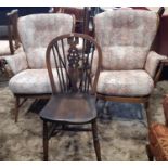 A pair of Ercol stick back armchairs with upholstered finish together with a single Windsor