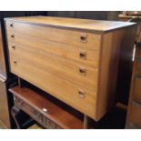 A mid century teakwood chest of four long graduated drawers by Alfred Cox 108 cm wide