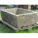 A good weathered rectangular natural stone trough with tapered interior, 102 cm long x 63 cm wide